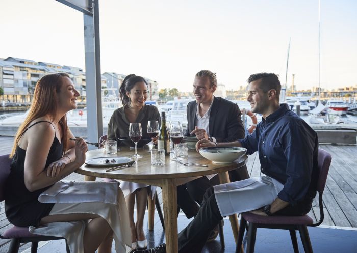 LuMi Dining, Pyrmont Friends enjoying food and drink at waterside restaurant LuMi Bar & Dining in Pyrmont